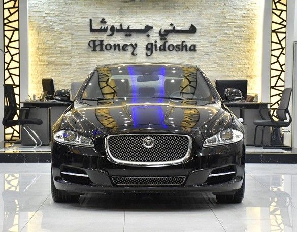 Подержанный Jaguar XJ IV (X351), 5.0 л, 2013 в Шардже от Honey Gidosha Used Cars Tr. Черный цвет.  | AUTO.AE