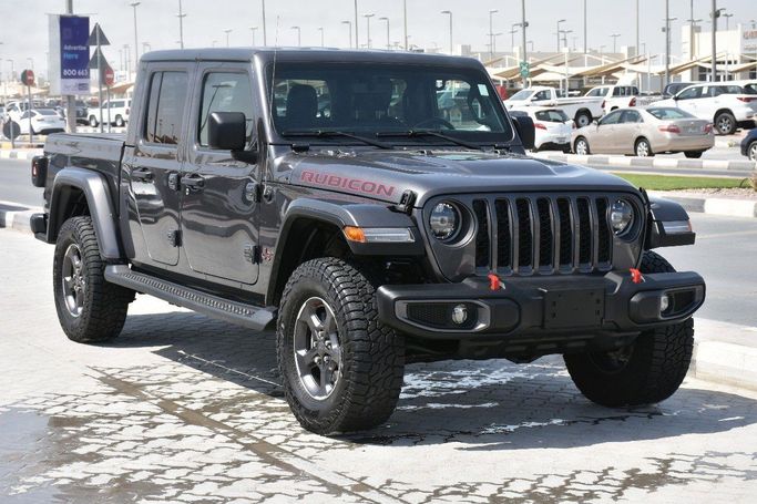 Подержанный Jeep Gladiator II (JT), 3.6 л, 2022 в Шардже от Alfaris Used Cars Серый цвет.  | AUTO.AE