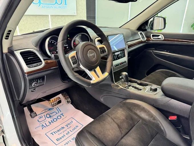 Used Jeep Grand Cherokee SRT IV (WK2) Facelift, 6.4 l, 2014 in Sharjah by Ayoon Alhoot Motors, White color. GCC Specs | AUTO.AE