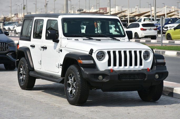 Подержанный Jeep Wrangler IV (JL), 3.6 л, 2021 в Шардже от Alfaris Used Cars Белый цвет.  | AUTO.AE