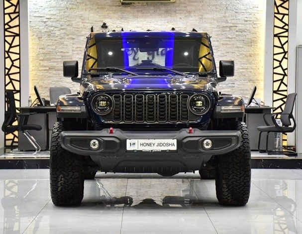 New Jeep Wrangler IV (JL) Facelift, 2.0 l, 2025 in Sharjah by Honey Gidosha Used Cars Tr., Blue color.  | AUTO.AE