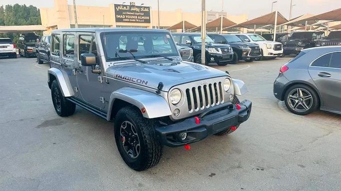 New Jeep Wrangler III (JK), 3.6 l, 2016 in Sharjah by Imad Younis Almani used Cars, Silver color. GCC Specs | AUTO.AE