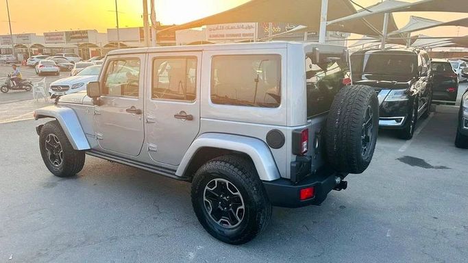 New Jeep Wrangler III (JK), 3.6 l, 2016 in Sharjah by Imad Younis Almani used Cars, Silver color. GCC Specs | AUTO.AE