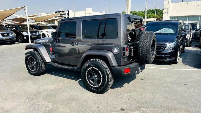 New Jeep Wrangler III (JK), 3.6 l, 2016 in Sharjah by Imad Younis Almani used Cars, Black color. GCC Specs | AUTO.AE