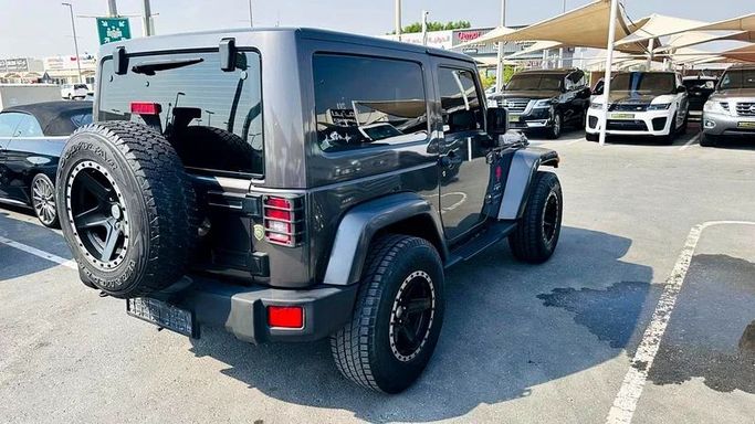 New Jeep Wrangler III (JK), 3.6 l, 2016 in Sharjah by Imad Younis Almani used Cars, Black color. GCC Specs | AUTO.AE