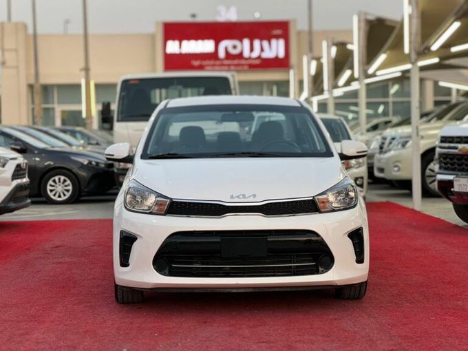 New Kia Pegas, 1.4 l, 2023 in Sharjah by Al Aram Cars, White color. GCC Specs | AUTO.AE