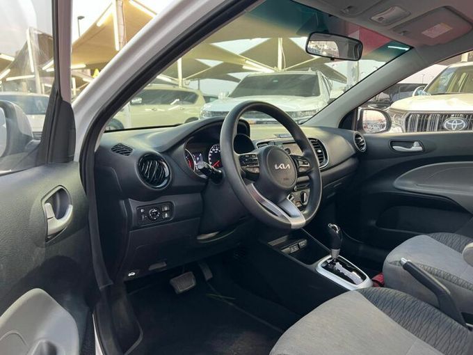 New Kia Pegas, 1.4 l, 2023 in Sharjah by Al Aram Cars, White color. GCC Specs | AUTO.AE