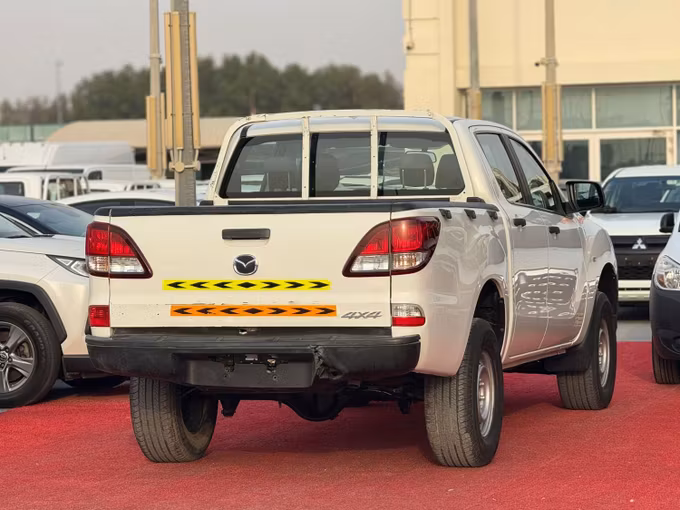Used Mazda BT-50 II Facelift, 2.5 l, 2020 in Sharjah by Al Aram Cars, White color. GCC Specs | AUTO.AE