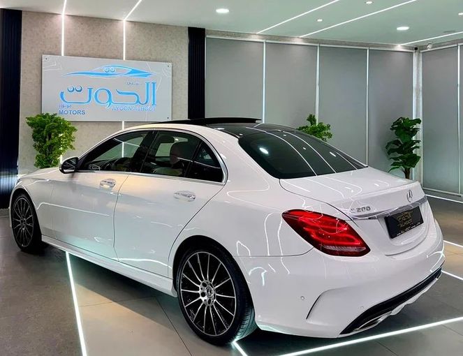 Used Mercedes-Benz C-Class 200 IV (W205) Facelift, 2.0 l, 2019 in Sharjah by Ayoon Alhoot Motors, White color. GCC Specs | AUTO.AE