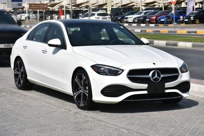 Used Mercedes-Benz C-Class 300 V (W206), 2.0 l, 2022 in Sharjah by Alfaris Used Cars, White color.  | AUTO.AE