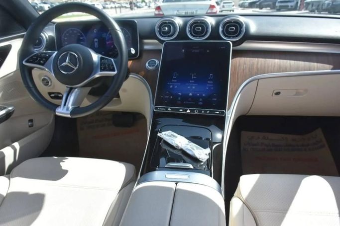 Used Mercedes-Benz C-Class 300 V (W206), 2.0 l, 2022 in Sharjah by Alfaris Used Cars, White color.  | AUTO.AE