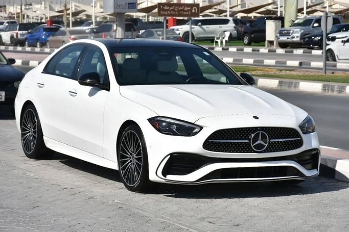 Used Mercedes-Benz C-Class 300 V (W206), 2.0 l, 2022 in Sharjah by Alfaris Used Cars, White color.  | AUTO.AE