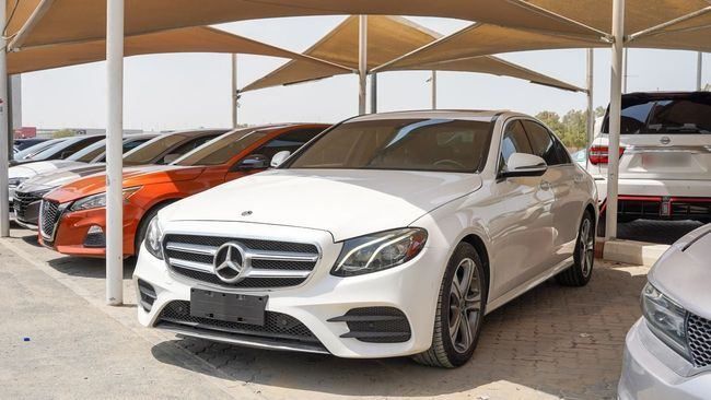 Used Mercedes-Benz E-Class 300 V (W213, S213, C238), 2.0 l, 2018 in Sharjah by Alnujoom Al Malakiah Used Cars, White color. Other | AUTO.AE