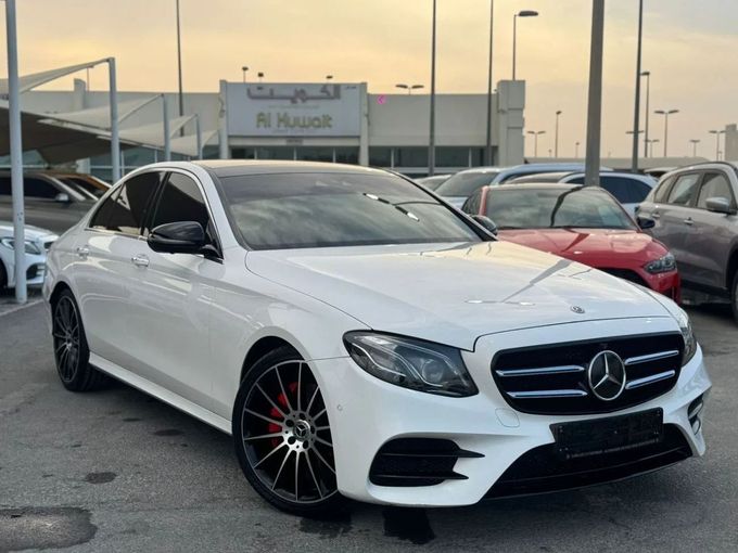 Used Mercedes-Benz E-Class 300 V (W213, S213, C238), 2.0 l, 2018 in Sharjah by Nour Alnukhba Motors, White color. GCC Specs | AUTO.AE