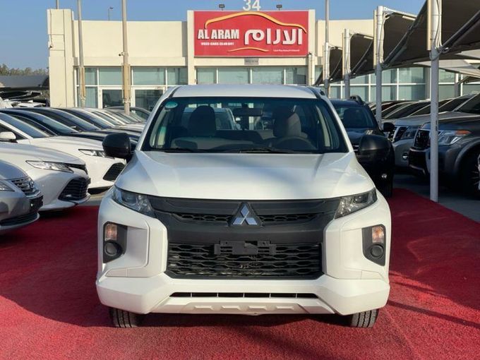 New Mitsubishi L200 V Facelift, 2.4 l, 2021 in Sharjah by Al Aram Cars, White color. GCC Specs | AUTO.AE