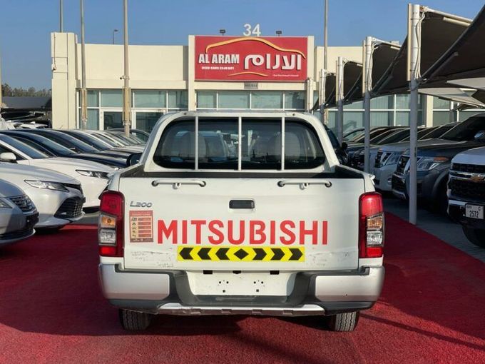 New Mitsubishi L200 V Facelift, 2.4 l, 2021 in Sharjah by Al Aram Cars, White color. GCC Specs | AUTO.AE