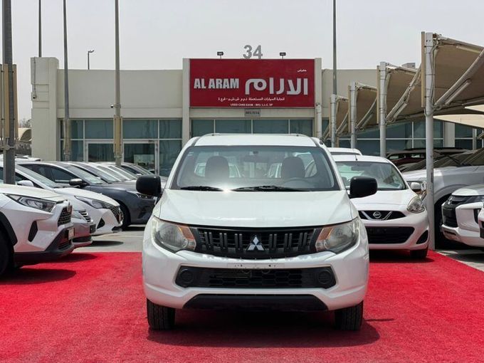 New Mitsubishi L200 V, 2.4 l, 2019 in Sharjah by Al Aram Cars, White color. GCC Specs | AUTO.AE