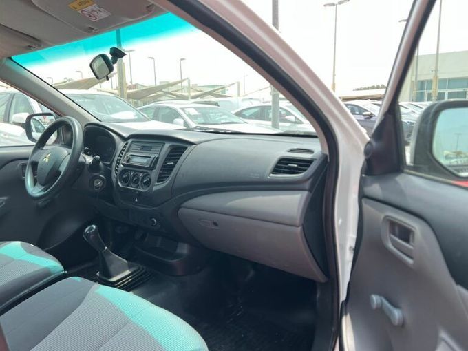 New Mitsubishi L200 V, 2.4 l, 2019 in Sharjah by Al Aram Cars, White color. GCC Specs | AUTO.AE