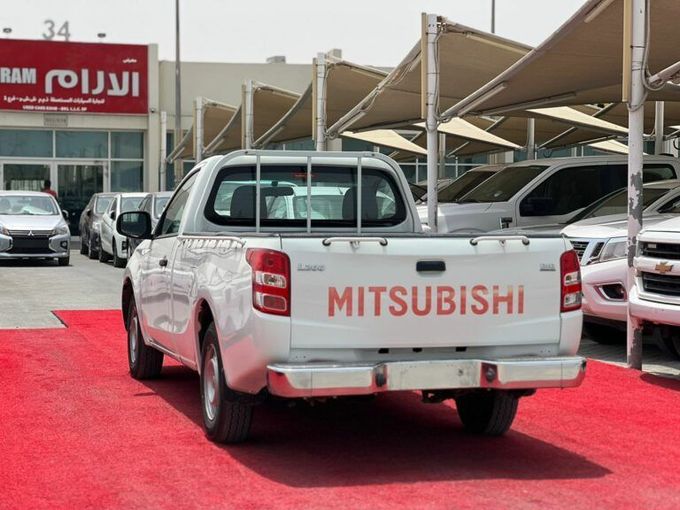 New Mitsubishi L200 V, 2.4 l, 2019 in Sharjah by Al Aram Cars, White color. GCC Specs | AUTO.AE