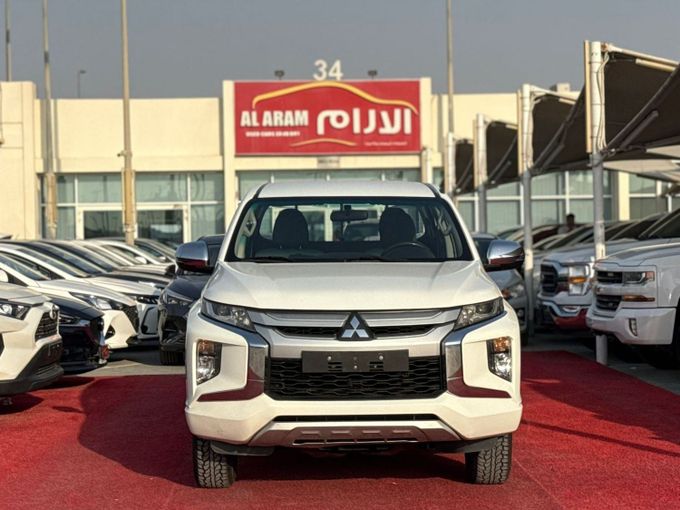 Used Mitsubishi L200 V Facelift, 2.4 l, 2022 in Sharjah by Al Aram Cars, White color. GCC Specs | AUTO.AE