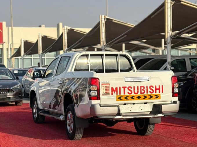Used Mitsubishi L200 V Facelift, 2.4 l, 2022 in Sharjah by Al Aram Cars, White color. GCC Specs | AUTO.AE