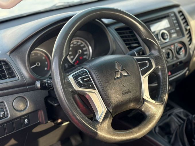 Used Mitsubishi L200 V Facelift, 2.4 l, 2022 in Sharjah by Al Aram Cars, White color. GCC Specs | AUTO.AE