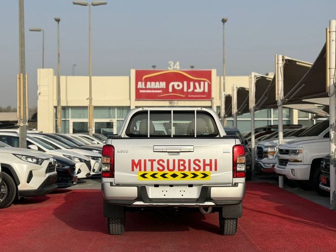 Used Mitsubishi L200 V Facelift, 2.4 l, 2020 in Sharjah by Al Aram Cars, White color. GCC Specs | AUTO.AE