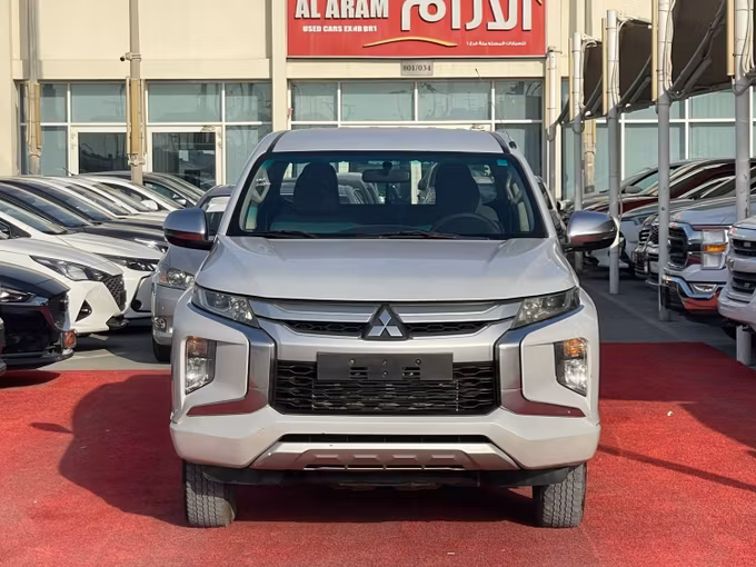 Used Mitsubishi L200 V Facelift, 2.4 l, 2020 in Sharjah by Al Aram Cars, White color. GCC Specs | AUTO.AE