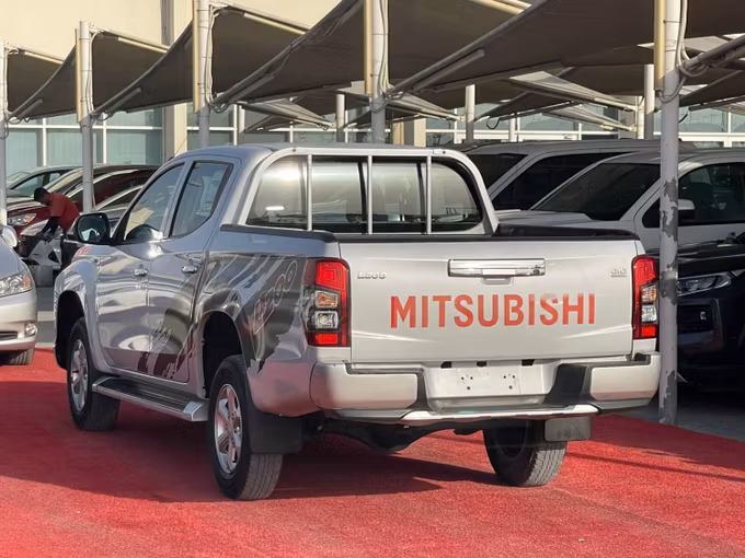 Used Mitsubishi L200 V Facelift, 2.4 l, 2020 in Sharjah by Al Aram Cars, White color. GCC Specs | AUTO.AE