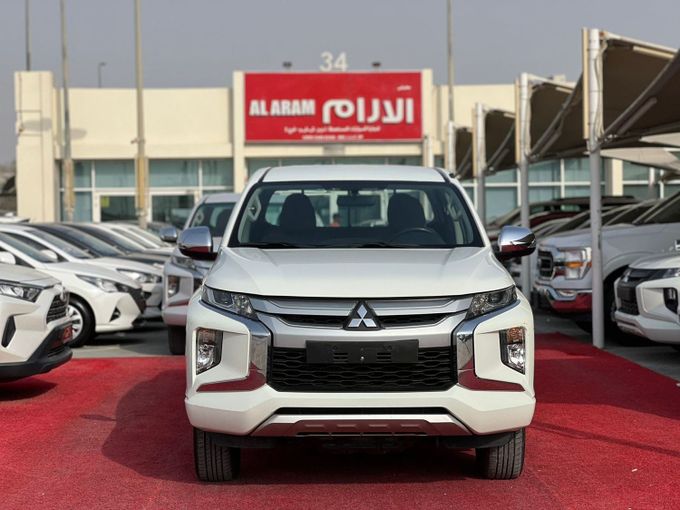 Used Mitsubishi L200 V Facelift, 2.4 l, 2023 in Sharjah by Al Aram Cars, White color. GCC Specs | AUTO.AE