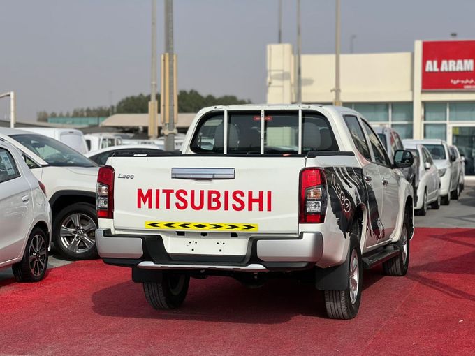 Used Mitsubishi L200 V Facelift, 2.4 l, 2023 in Sharjah by Al Aram Cars, White color. GCC Specs | AUTO.AE
