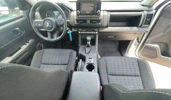 New Mitsubishi L200 VI, 2.4 l, 2023 in Sharjah by Nour Alnukhba Motors, White color. GCC Specs | AUTO.AE