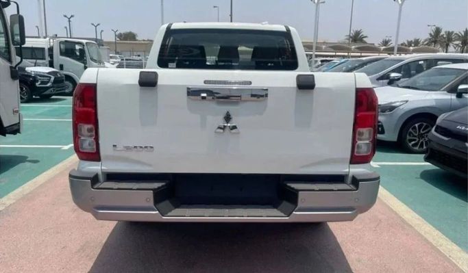 New Mitsubishi L200 VI, 2.4 l, 2023 in Sharjah by Nour Alnukhba Motors, White color. GCC Specs | AUTO.AE
