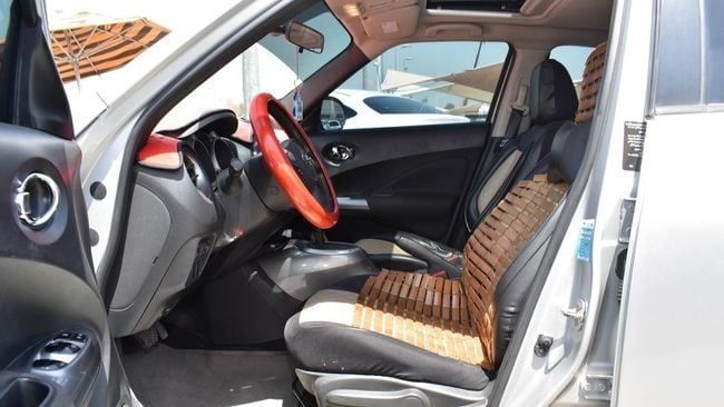 Подержанный Nissan Juke I Рестайлинг, 1.6 л, 2014 в Шардже от Alnujoom Al Malakiah Used Cars Серебристый цвет. GCC | AUTO.AE