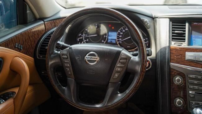 Used Nissan Patrol VI (Y62), 5.6 l, 2014 in Sharjah by Alnujoom Al Malakiah Used Cars, White color. GCC Specs | AUTO.AE