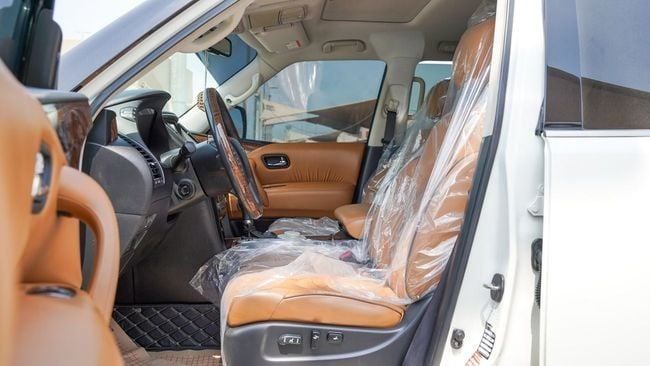 Used Nissan Patrol VI (Y62), 5.6 l, 2014 in Sharjah by Alnujoom Al Malakiah Used Cars, White color. GCC Specs | AUTO.AE