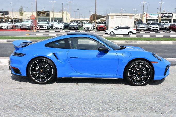 مستعملة Porsche 911 Turbo VIII (992), 3.7 l, 2023 في في الشارقة من Alfaris Used Cars، اللون أزرق.  | AUTO.AE