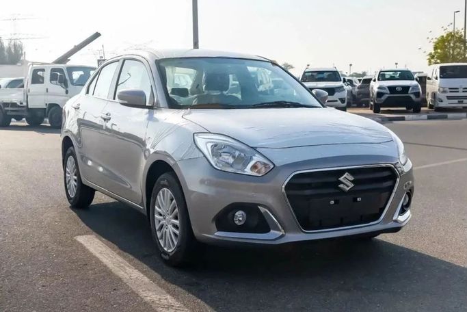 Новый Suzuki DZire III Рестайлинг, 1.2 л, 2024 в Шардже от Nour Alnukhba Motors Серебристый цвет. Other | AUTO.AE