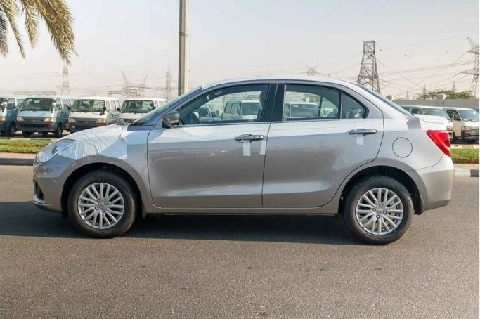 Новый Suzuki DZire III Рестайлинг, 1.2 л, 2024 в Шардже от Nour Alnukhba Motors Серебристый цвет. Other | AUTO.AE