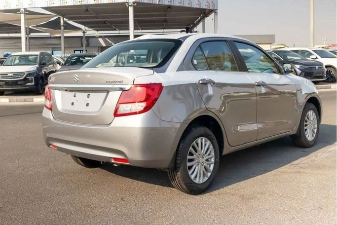 Новый Suzuki DZire III Рестайлинг, 1.2 л, 2024 в Шардже от Nour Alnukhba Motors Серебристый цвет. Other | AUTO.AE
