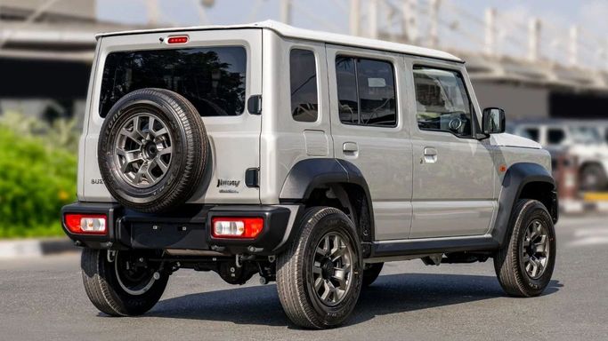 New Suzuki Jimny IV, 1.5 l, 2025 in Sharjah by Nour Alnukhba Motors, Silver color. GCC Specs | AUTO.AE