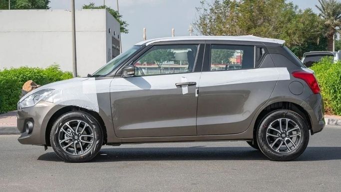 Новый Suzuki Swift VI, 1.2 л, 2023 в Шардже от Nour Alnukhba Motors Бронзовый цвет. Other | AUTO.AE