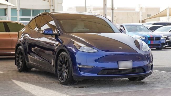 Подержанный Tesla Model Y Standart I, 2023 в Шардже от Abo Saif Синий цвет. Американская | AUTO.AE