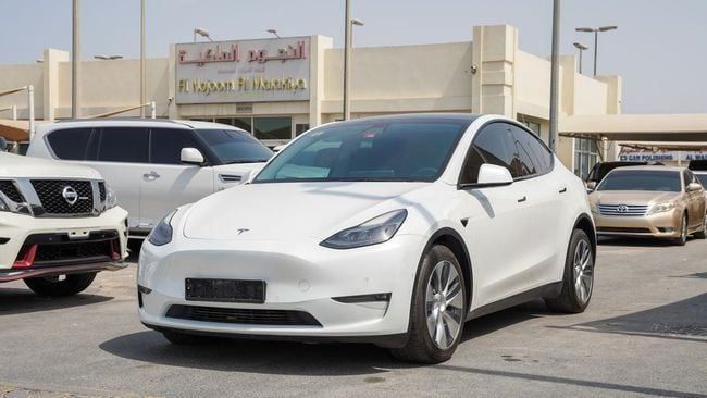 Used Tesla Model Y Performance I, 2023 in Sharjah by Alnujoom Al Malakiah Used Cars, White color. American Specs | AUTO.AE