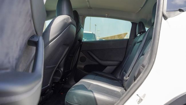 Used Tesla Model Y Performance I, 2023 in Sharjah by Alnujoom Al Malakiah Used Cars, White color. American Specs | AUTO.AE