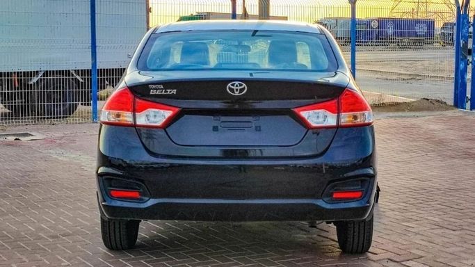 New Toyota Belta II, 1.5 l, 2023 in Sharjah by Nour Alnukhba Motors, Black color. GCC Specs | AUTO.AE
