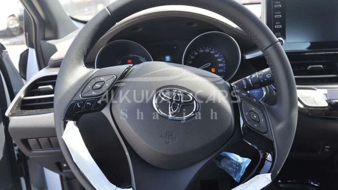New Toyota C-HR I Facelift, 1.8 l, 2023 in Sharjah by Nour Alnukhba Motors, White color. Other | AUTO.AE