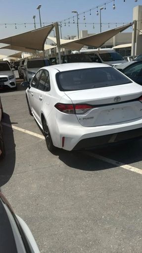 New Toyota Corolla XII (E210), 1.2 l, 2024 in Sharjah by Nour Alnukhba Motors, White color. Other | AUTO.AE