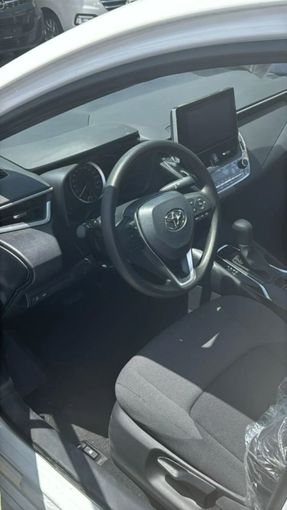 New Toyota Corolla XII (E210), 1.2 l, 2024 in Sharjah by Nour Alnukhba Motors, White color. Other | AUTO.AE
