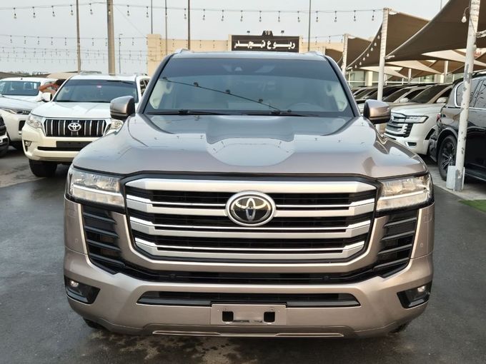 Used Toyota Land Cruiser 300 Series, 3.4 l, 2022 in Sharjah by Rebou Najd Used Cars, Brown color. GCC Specs | AUTO.AE